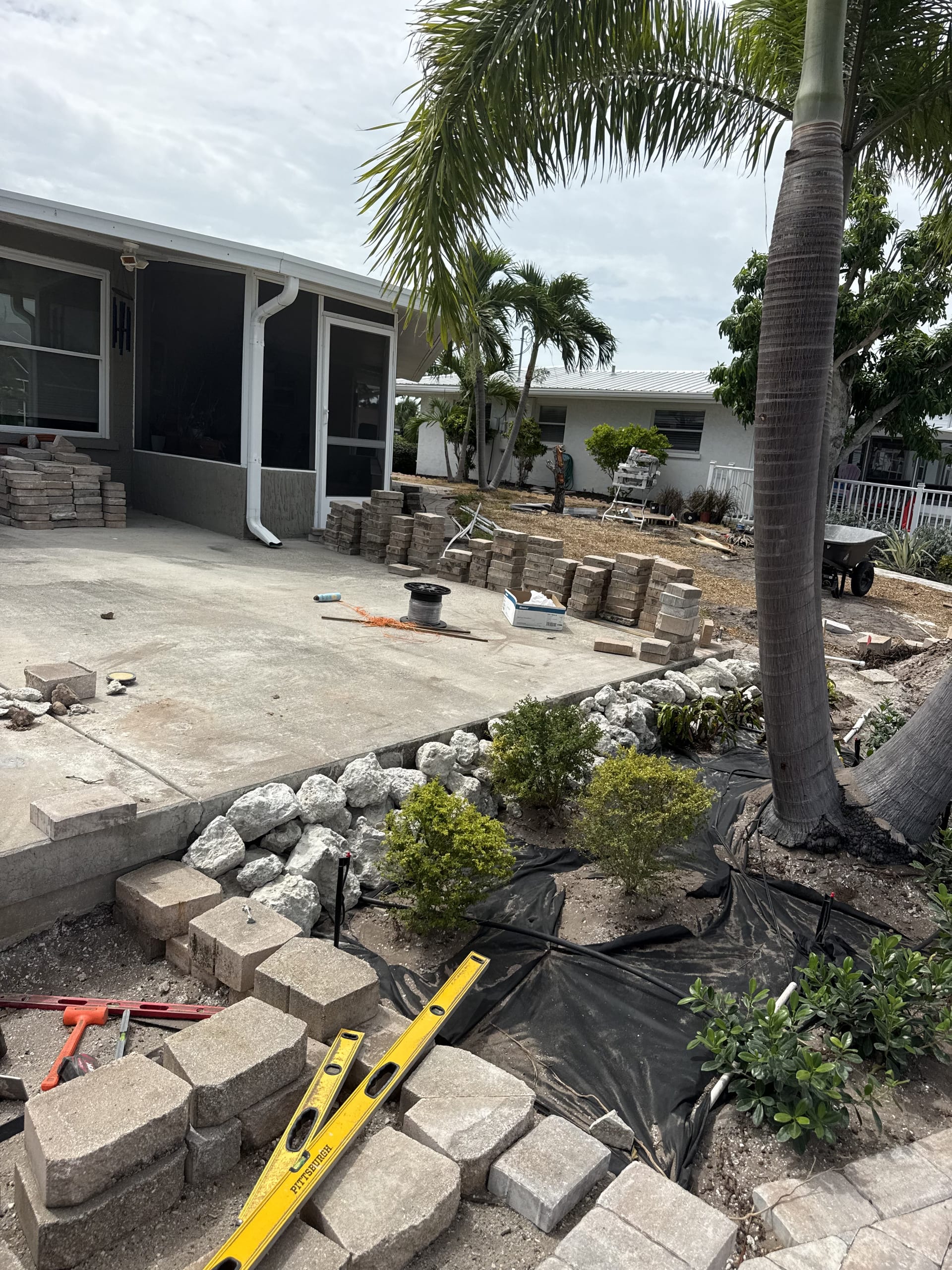 Base prep and grading for the backyard paver patio